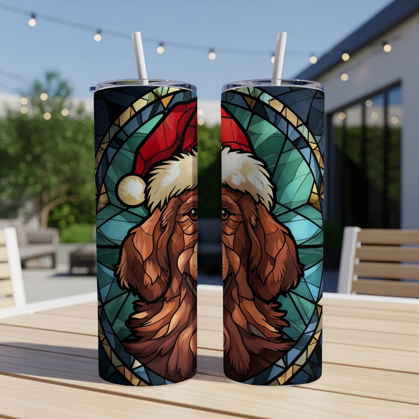 Two stained-glass style tumblers featuring a dog in a Santa hat.