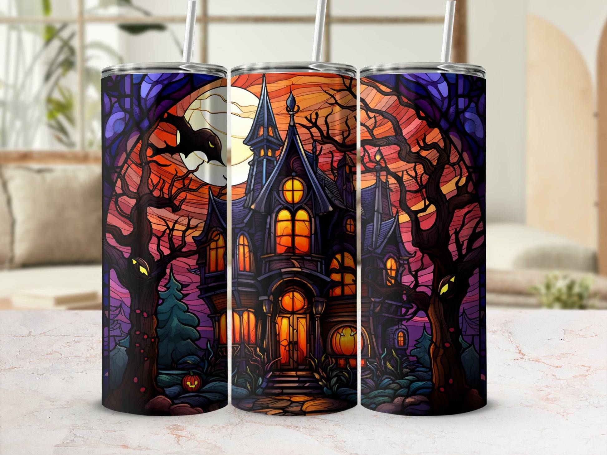 Spooky haunted house with moon and trees on a Halloween tumbler.