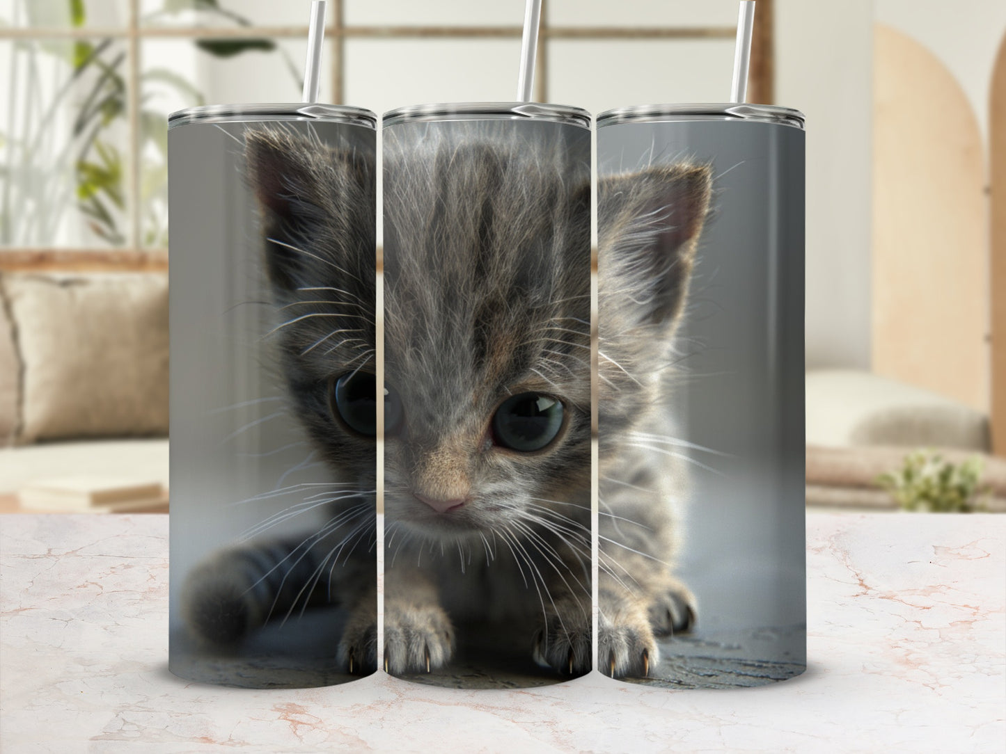 Three stainless steel tumblers featuring a close-up of a tabby kitten's face.