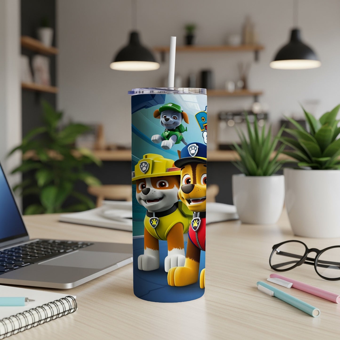 Paw Patrol characters Chase and Marshall on a blue tumbler with a straw.