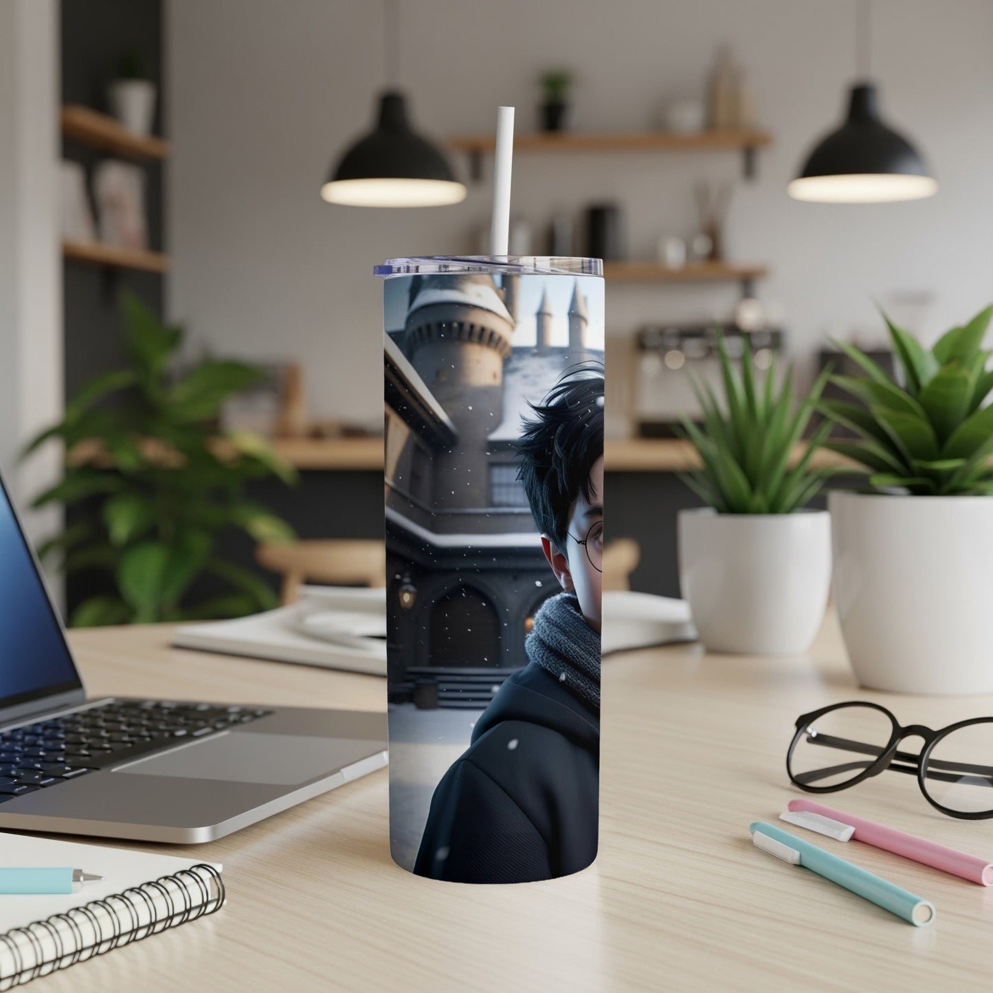 Harry Potter character art on a white tumbler with straw, desk background.