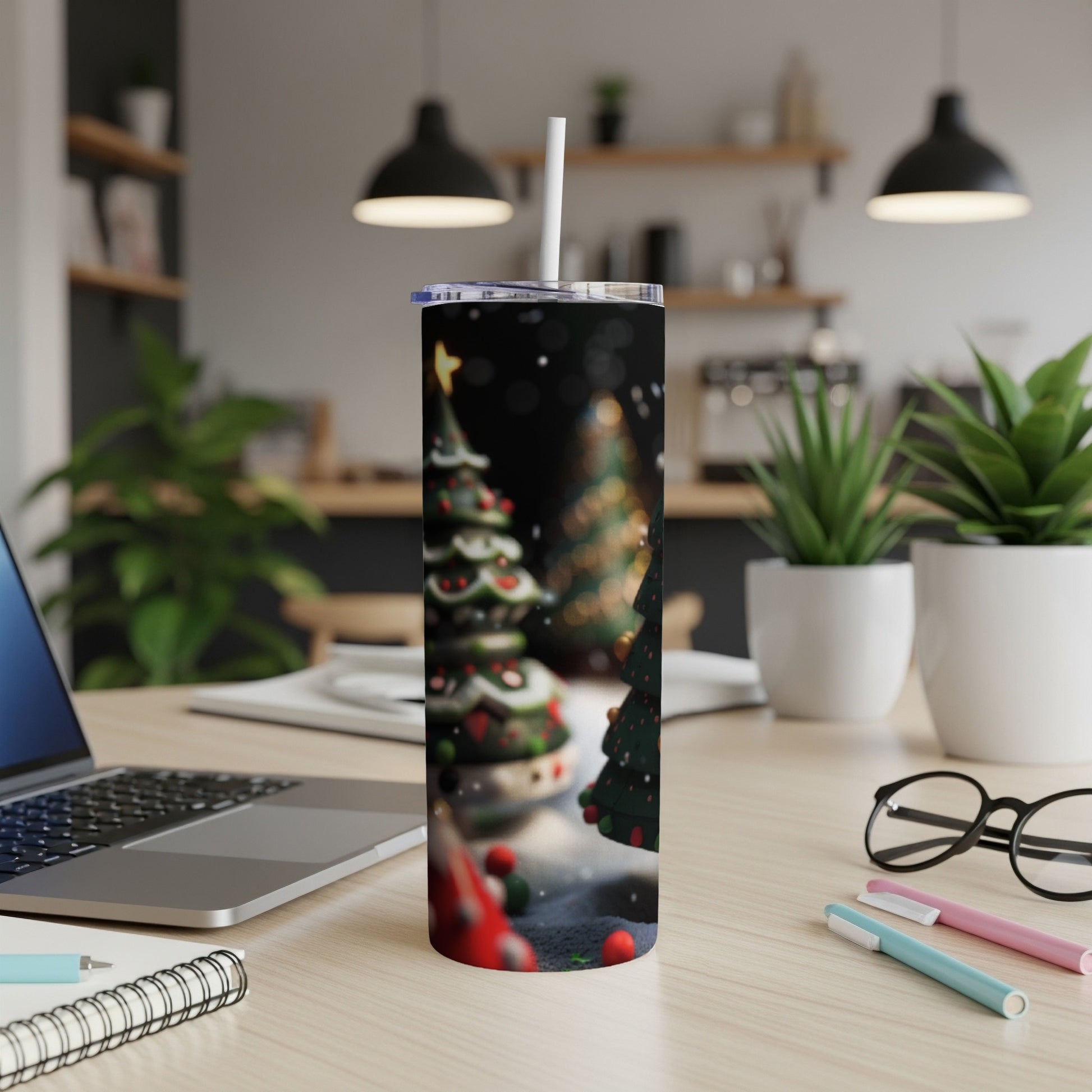 Christmas tree pattern on a white tumbler on a desk.