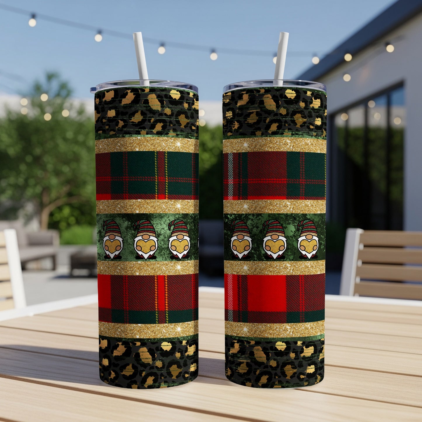 Two tall tumblers with gnome and plaid patterns, outdoors.