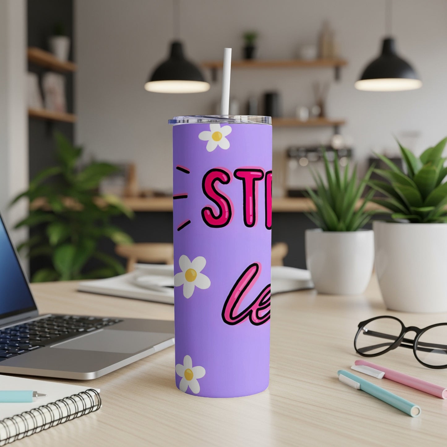Purple tumbler with "Still Sippin'" and white daisies.