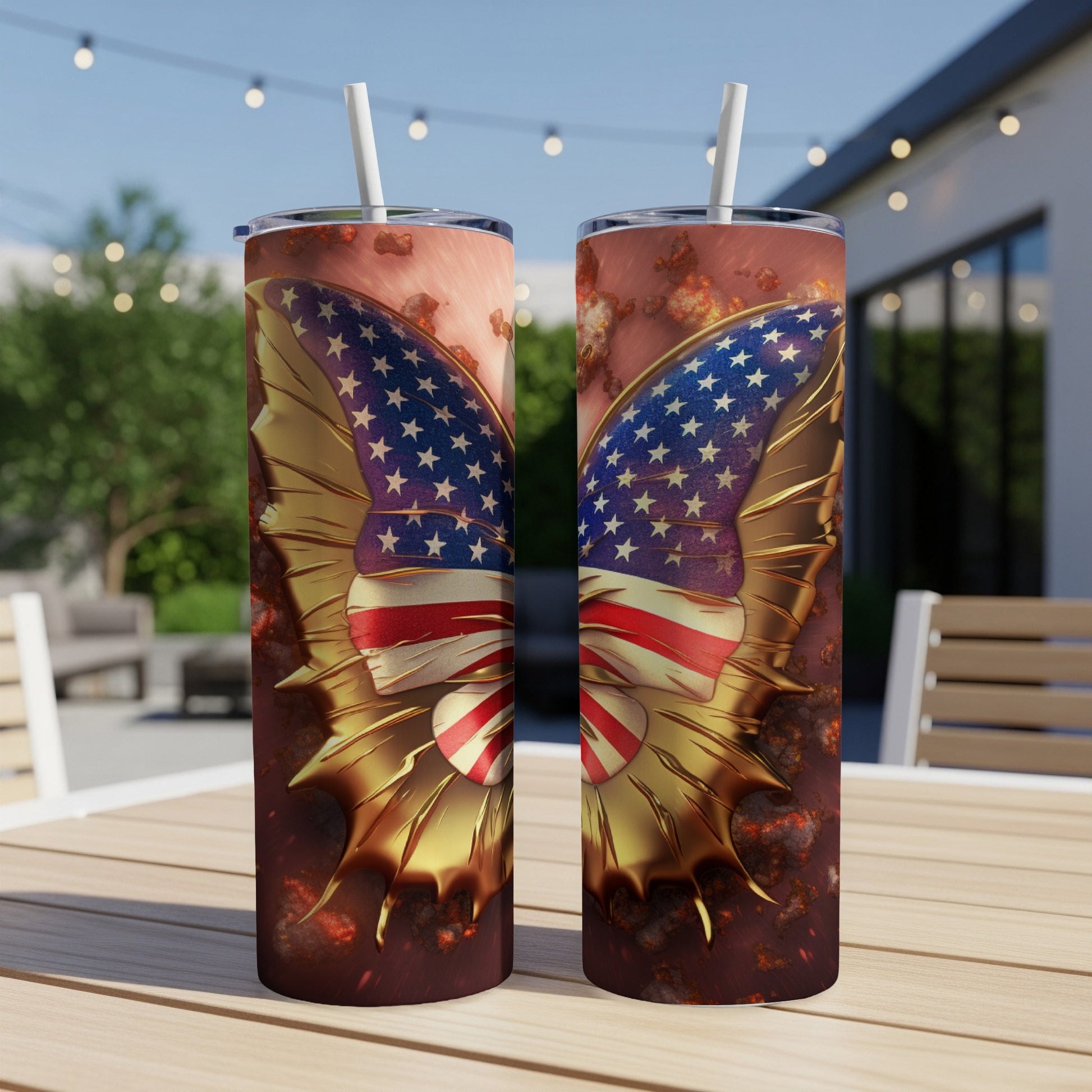 Two tumblers with American flag butterfly wings on a table outdoors.