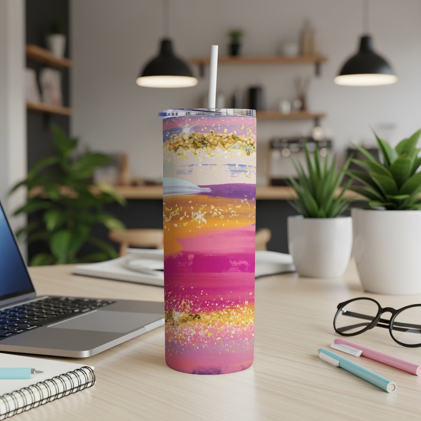 Tumbler with abstract pink, purple, and gold brushstrokes and glitter design.