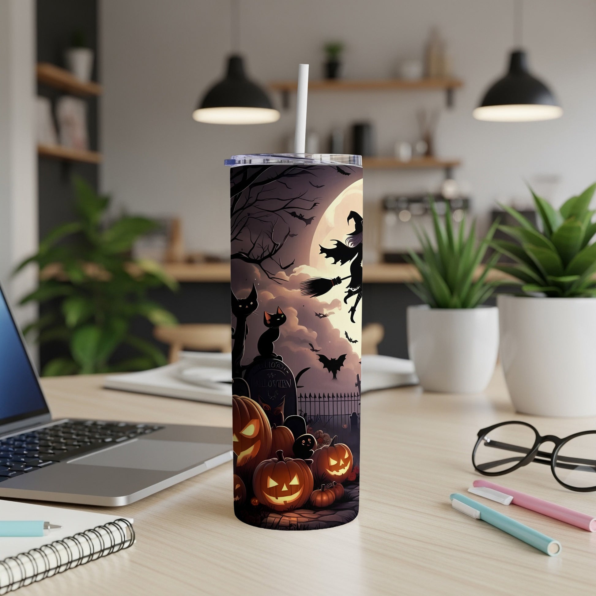 Halloween tumbler with witch, bats, cats, pumpkins, and a full moon graveyard scene.