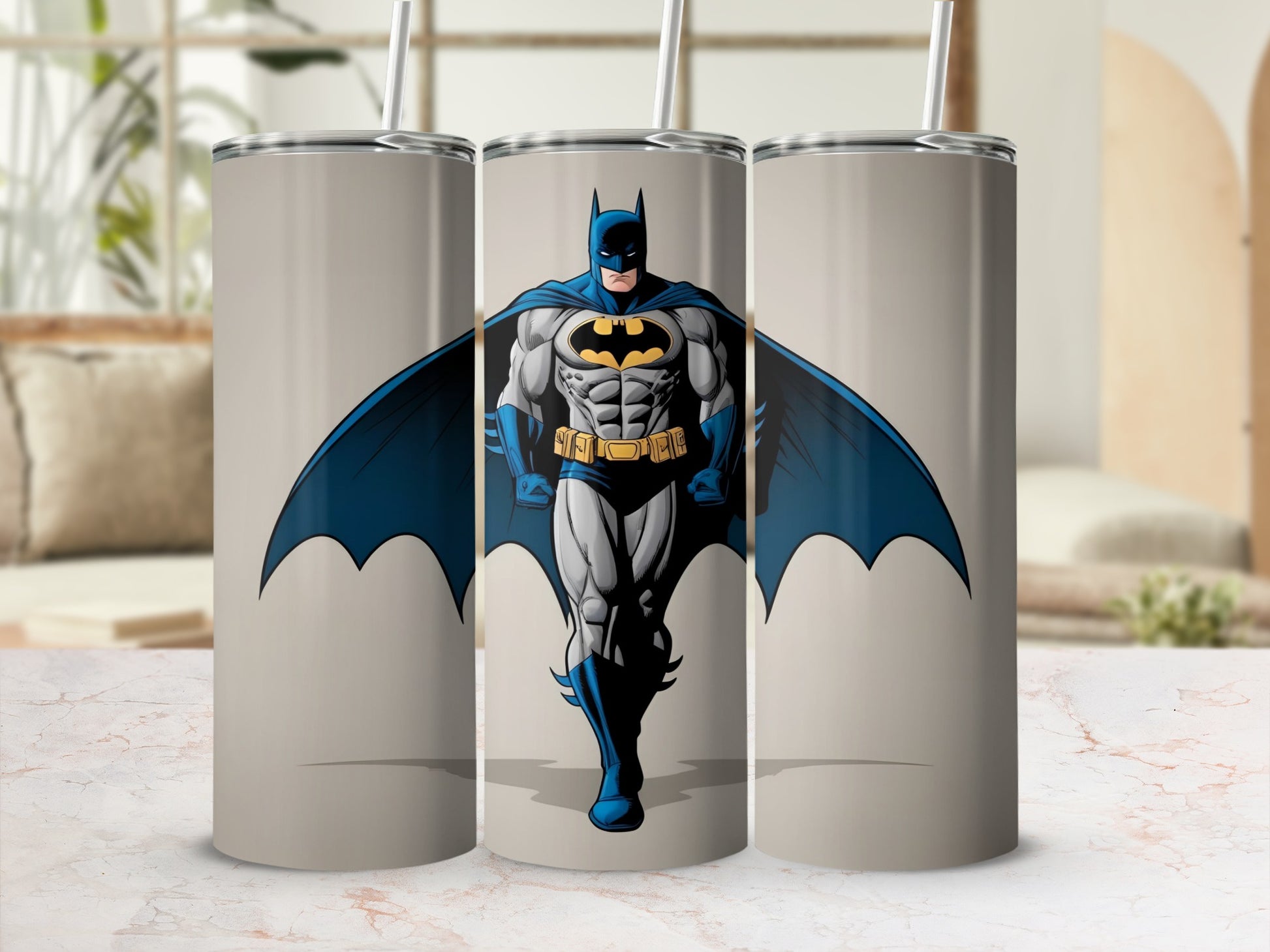 Batman in cowl and cape, standing heroically on a light gray tumbler.