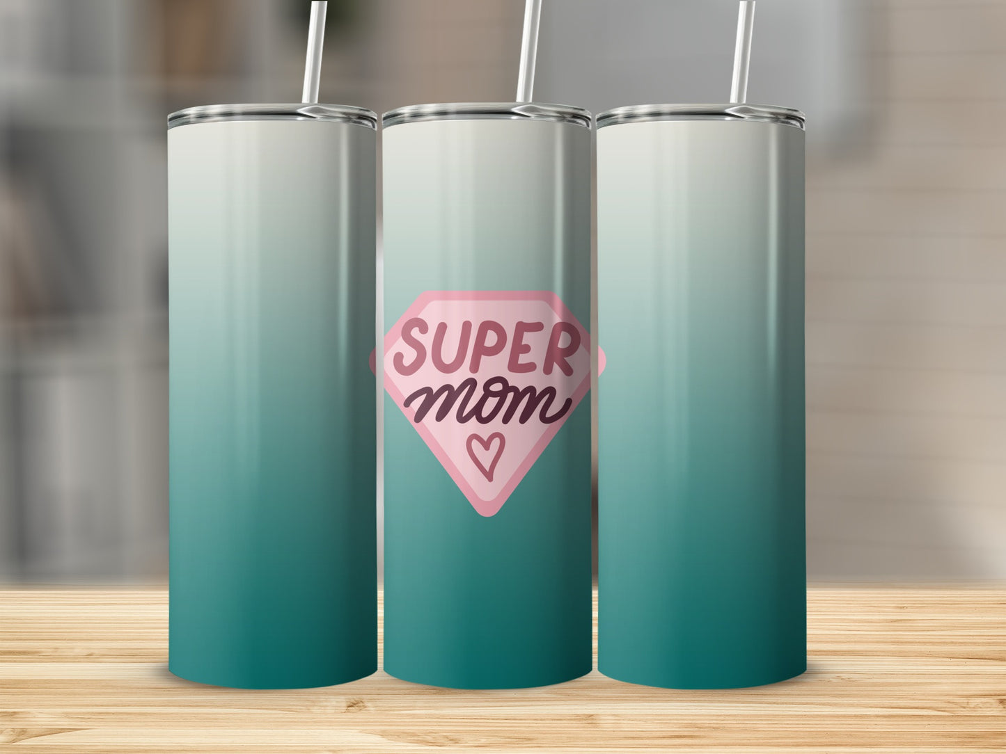 Tall tumbler with pink diamond "Super Mom" design and teal gradient.