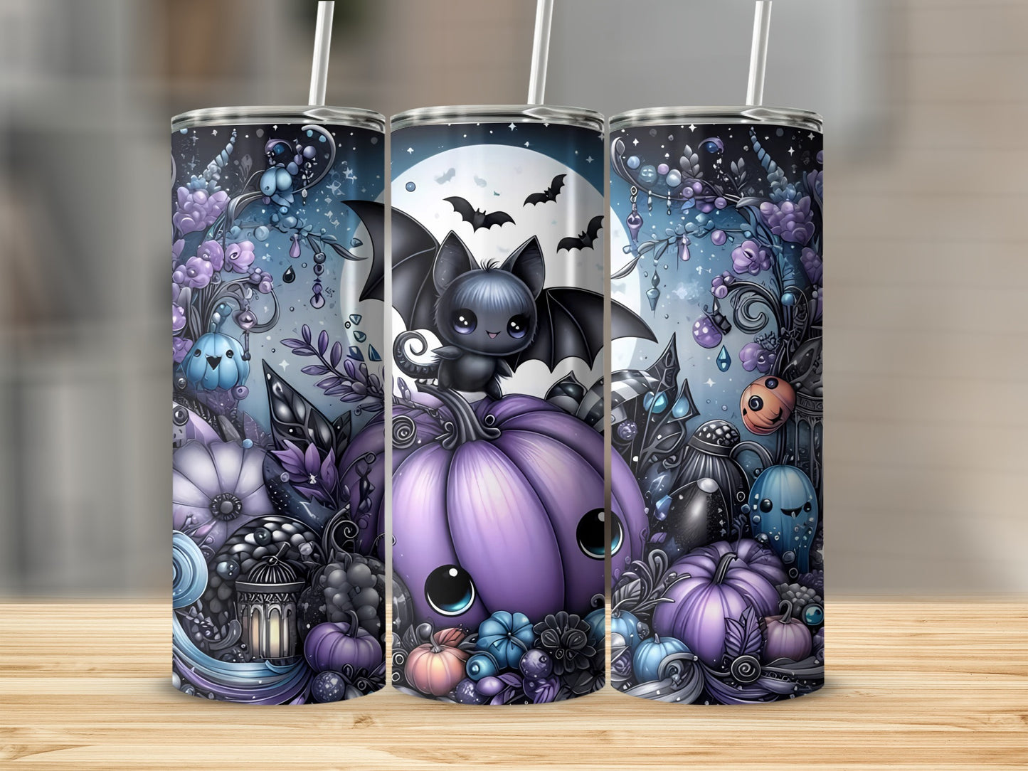 Three tumblers with a cute Halloween design featuring a bat and pumpkins.