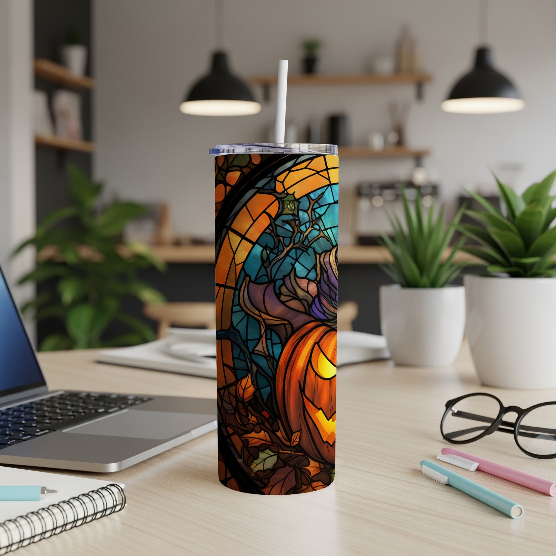 Stained glass tumbler featuring a Halloween pumpkin and autumn leaves design.