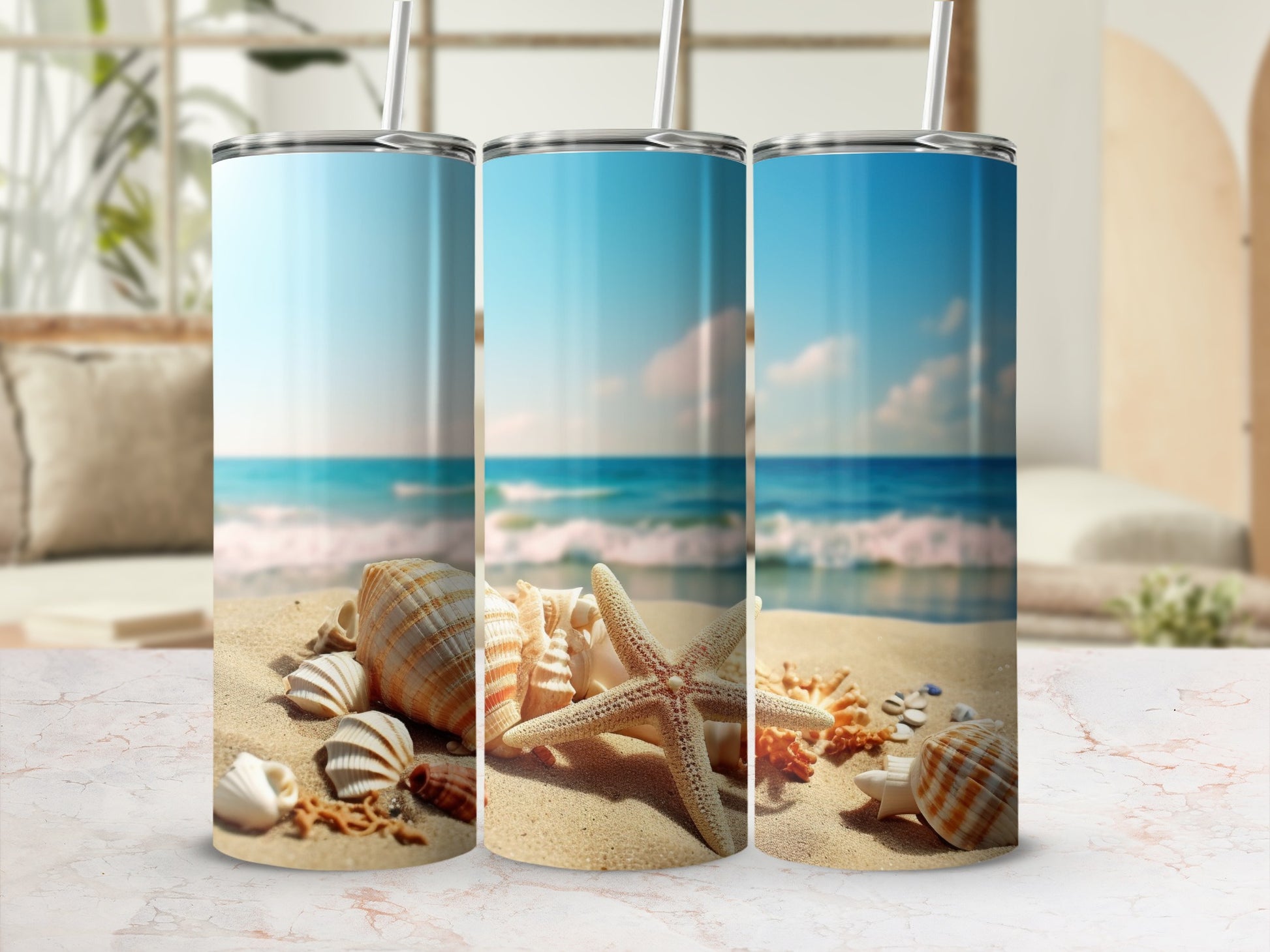 Three tumblers featuring a beach scene with shells and starfish.