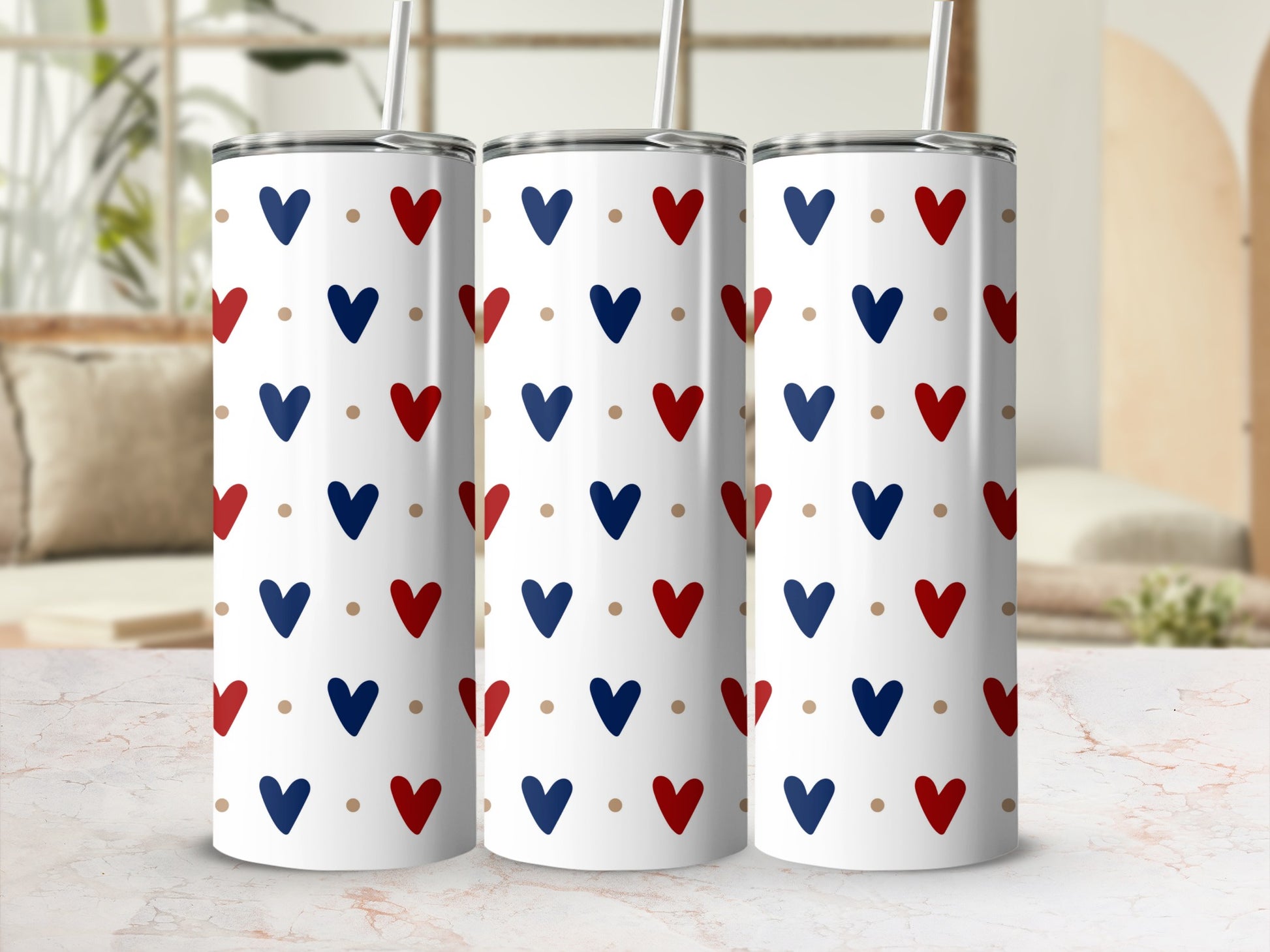 Three tumblers with a navy, red, and gold heart pattern.