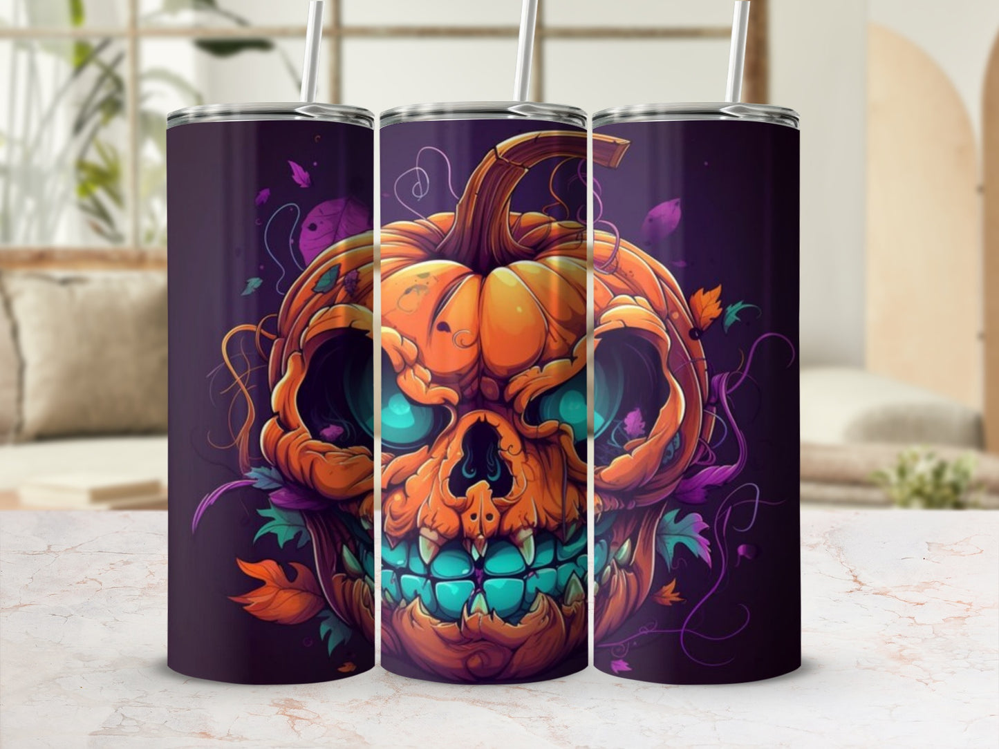 Three tumblers with a jack-o'-lantern skull design and falling autumn leaves.