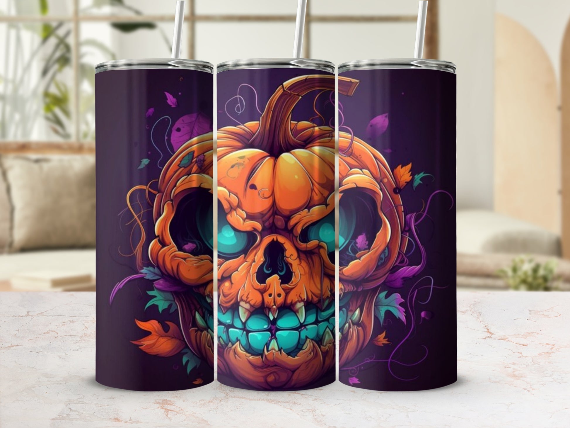 Three tumblers with a jack-o'-lantern skull design and falling autumn leaves.