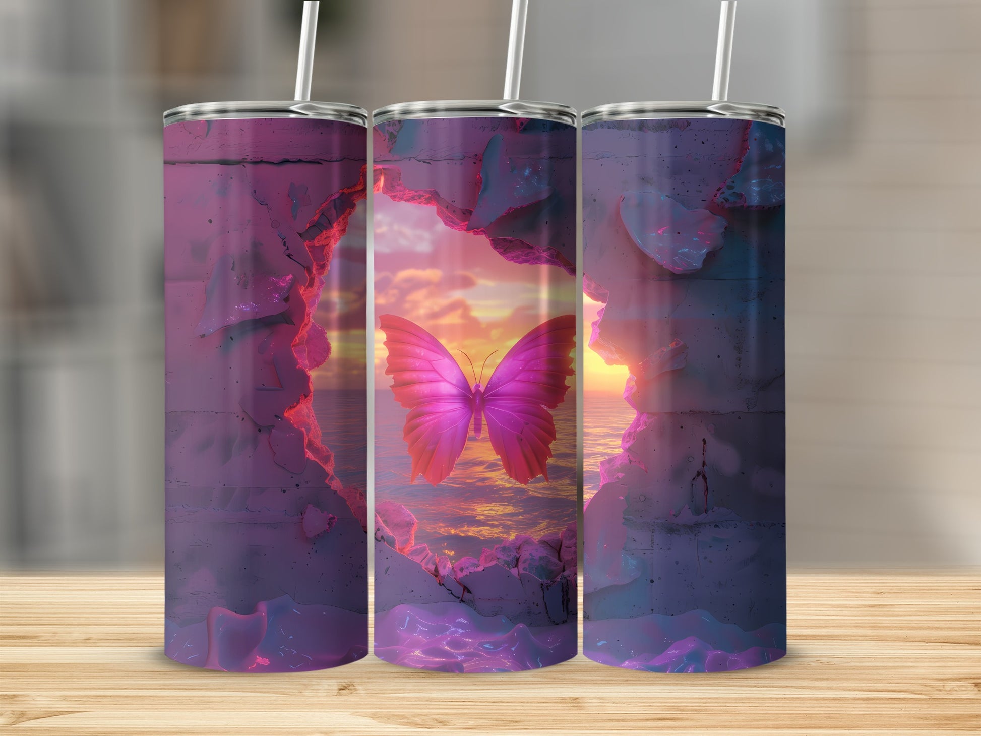 Three tumblers featuring a pink butterfly against a sunset ocean view.