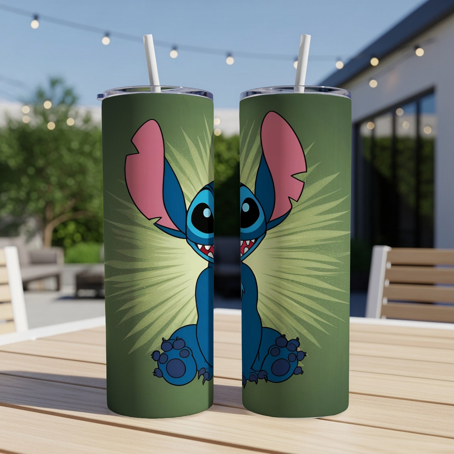 Two Stitch tumblers with green starburst background on a table.