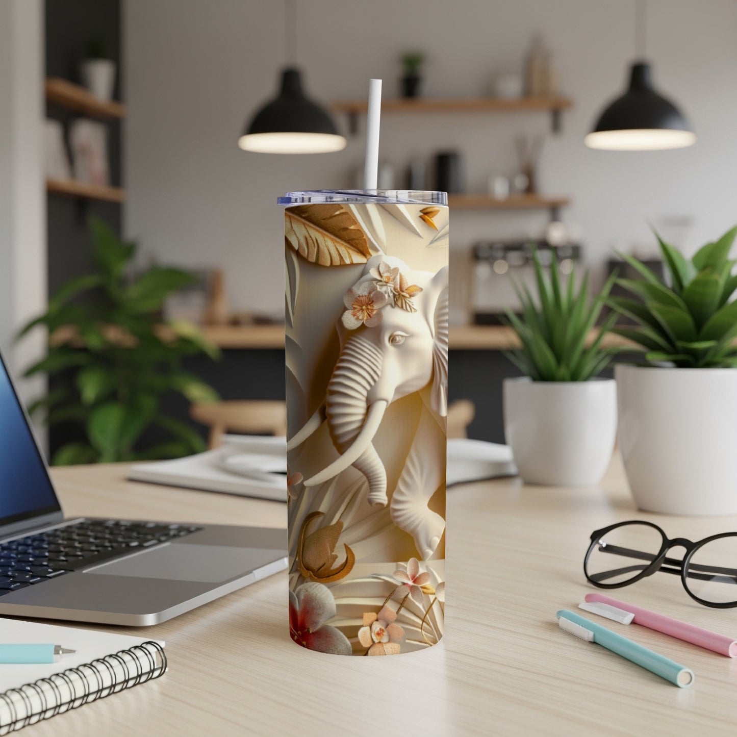 3D embossed elephant design on a tall, slim tumbler with floral accents.