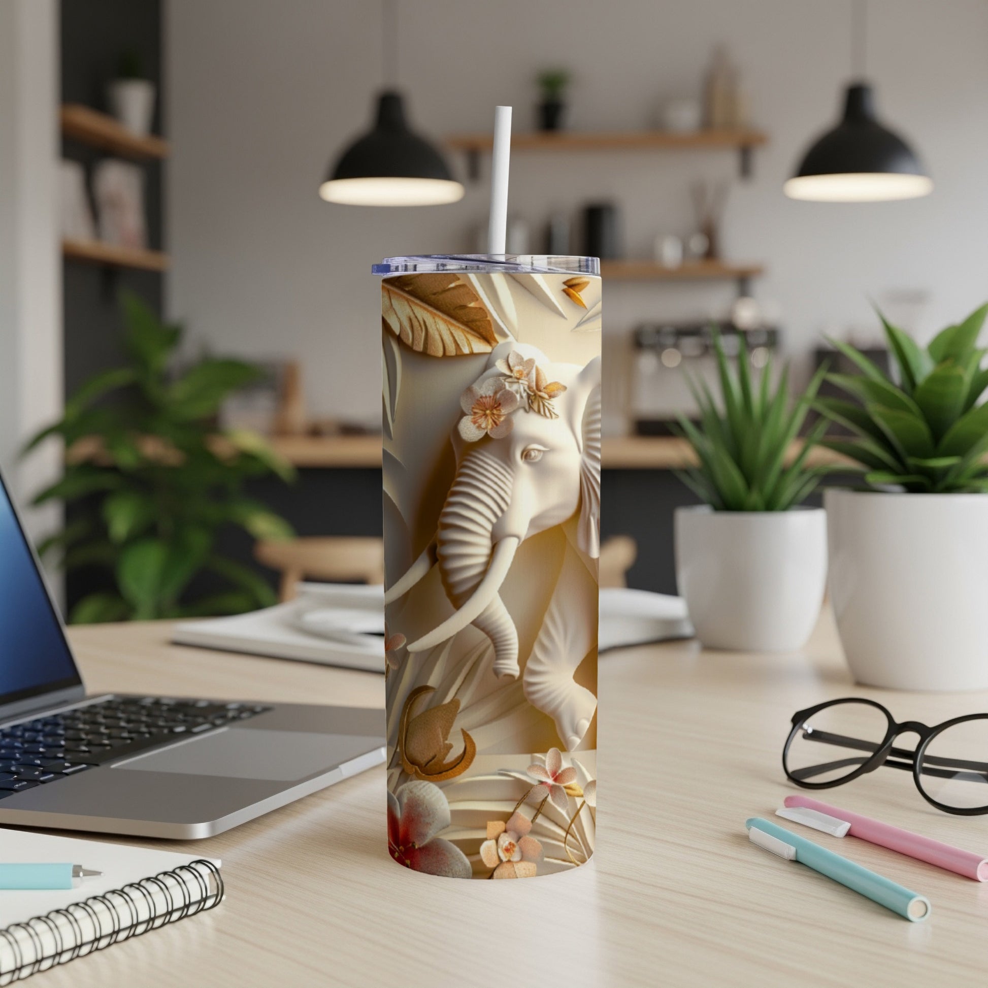 3D embossed elephant design on a tall, slim tumbler with floral accents.