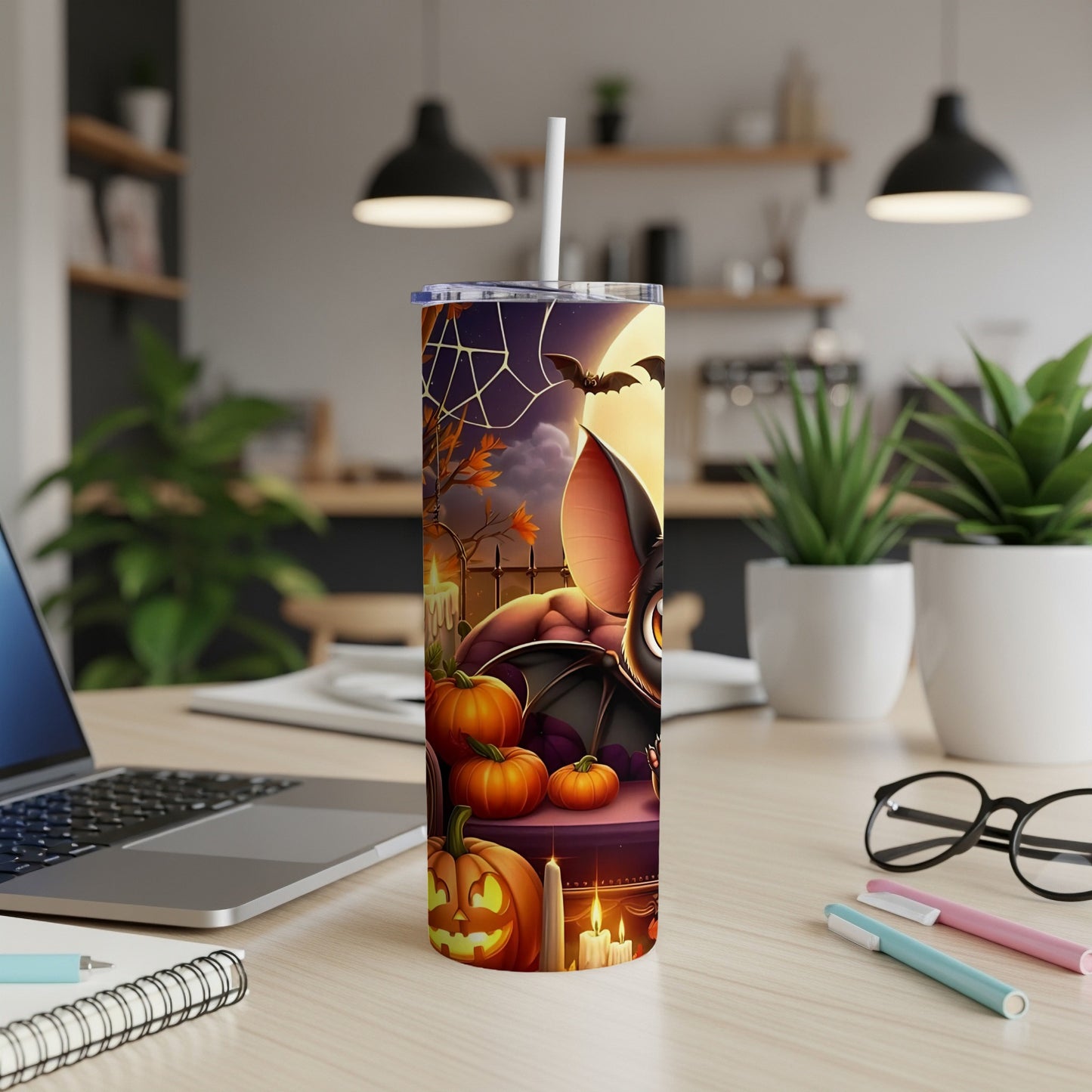 Halloween tumbler with cartoon bat, pumpkins, spiderweb, and candle design.