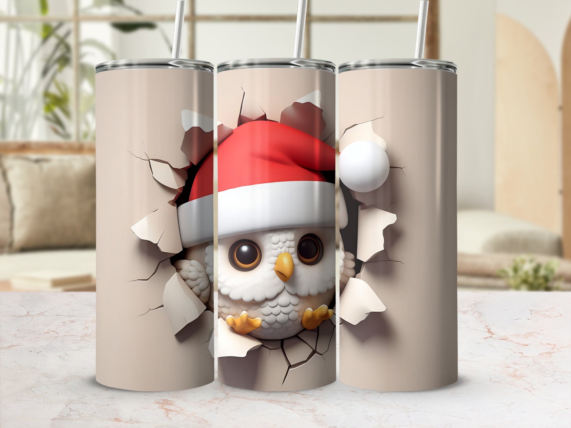 Three tumblers with a Christmas owl breaking through a surface.