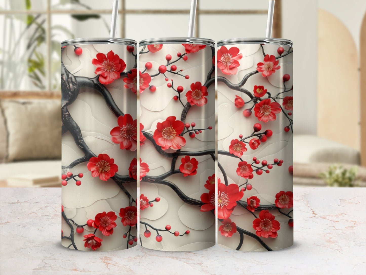 Three tumblers with red cherry blossoms on dark branches, against a creamy background.