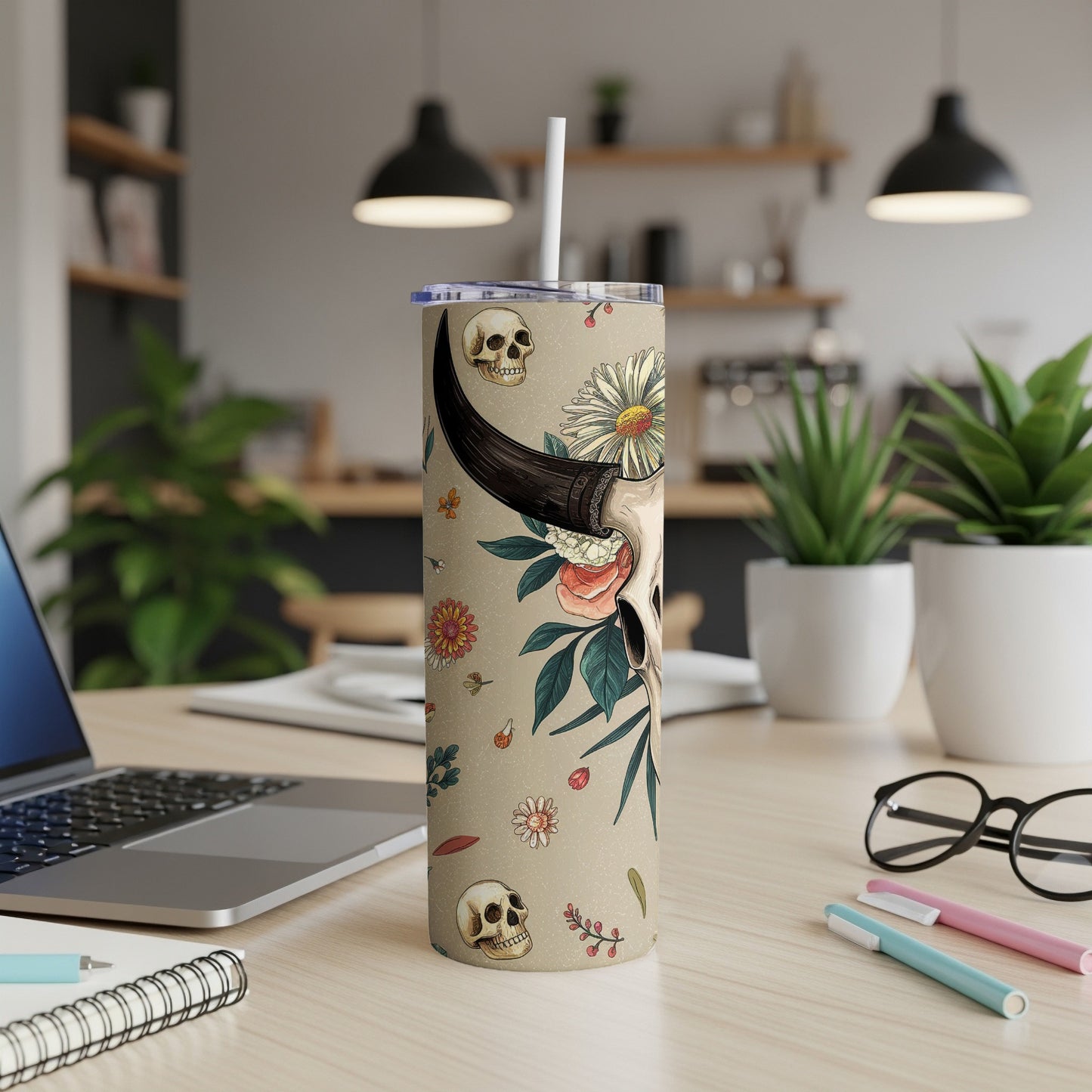 Tan tumbler with bull skull, skulls, and floral design, straw.