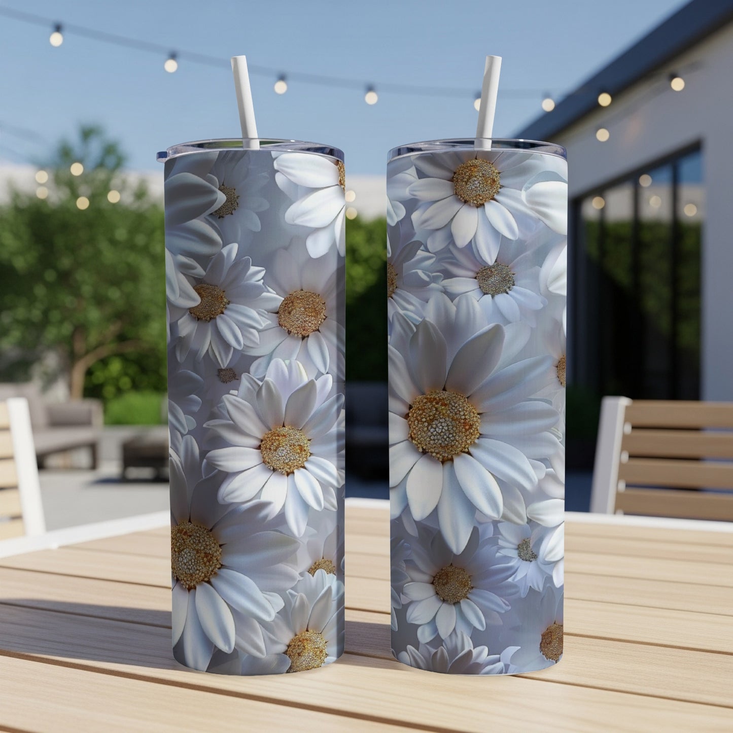 Two tall tumblers with a repeating white daisy floral pattern.