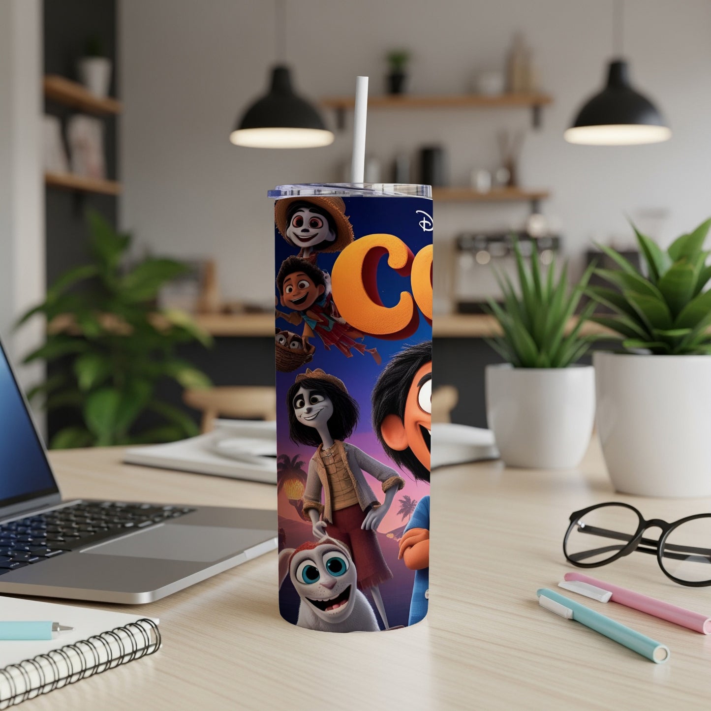 Coco movie characters on a tall, narrow tumbler with a straw.