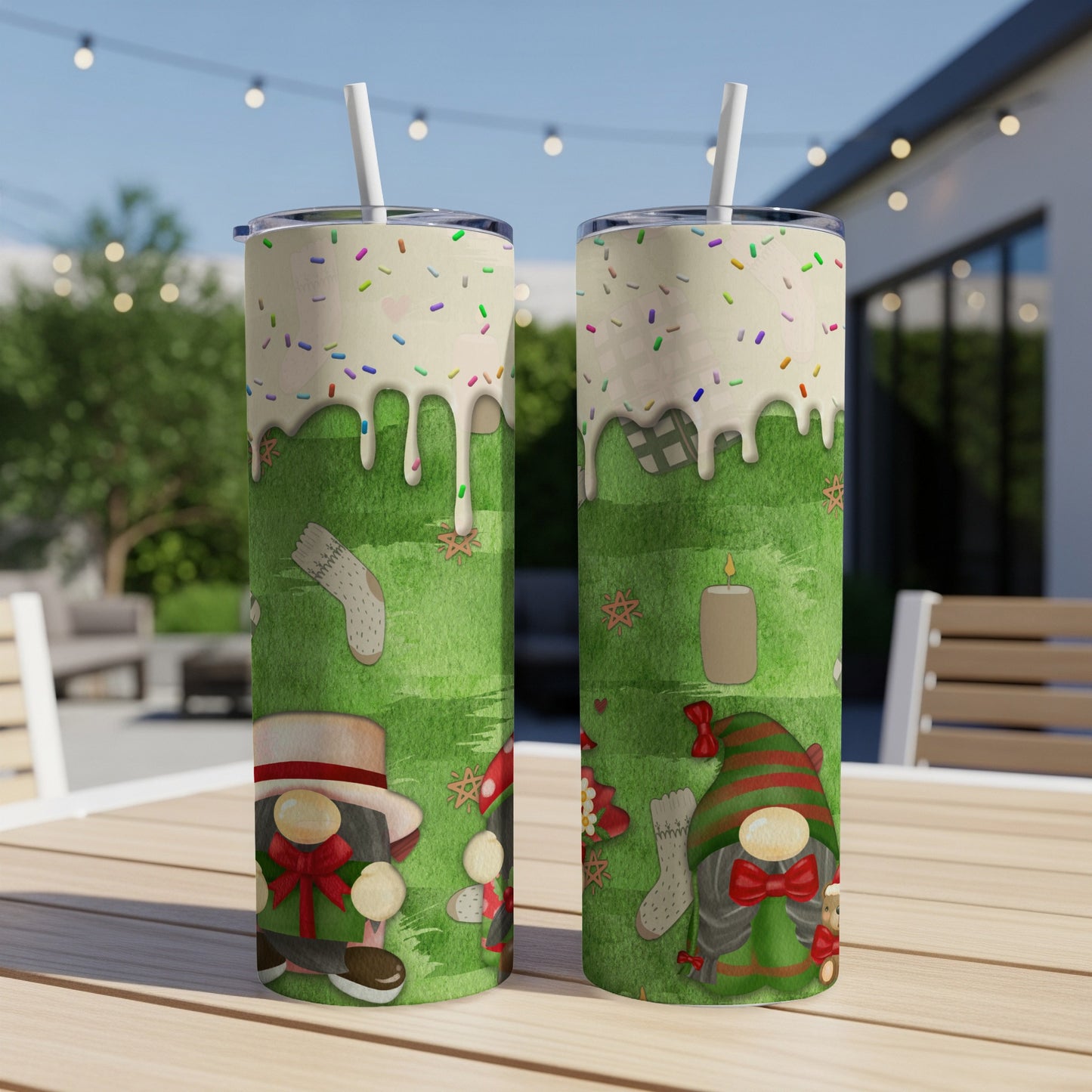 Two gnome-themed tumblers with green grass and holiday decorations.