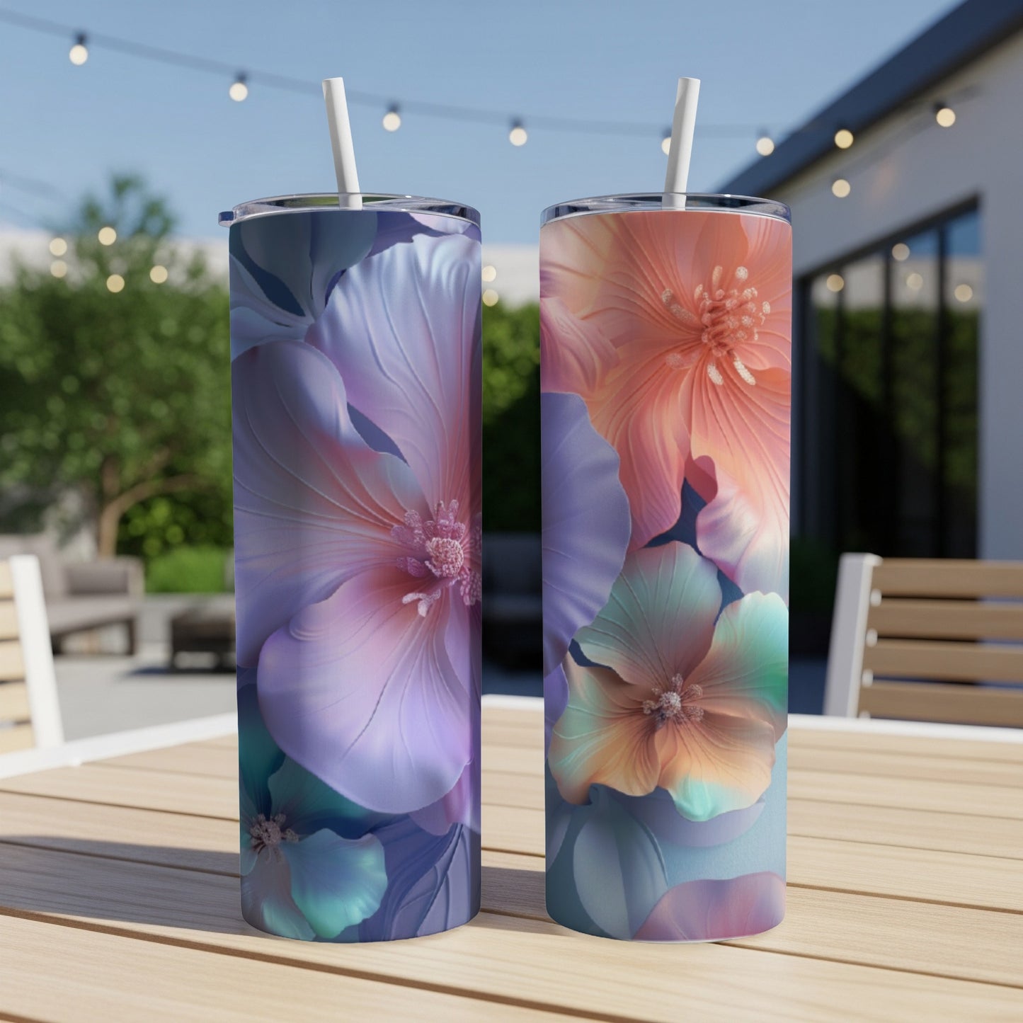 Two tall tumblers with floral designs, one purple and one pink, on a wooden table.