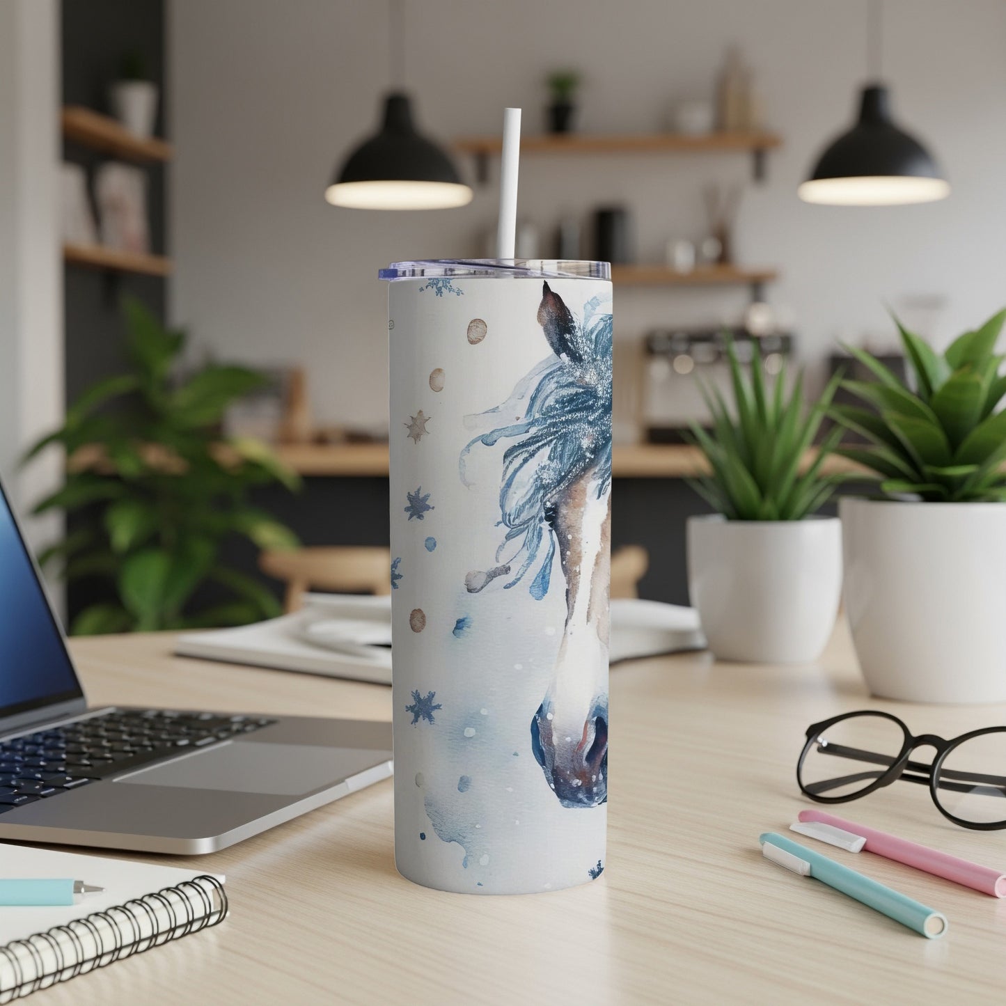 Watercolor horse head design on a white tumbler with blue snowflakes.