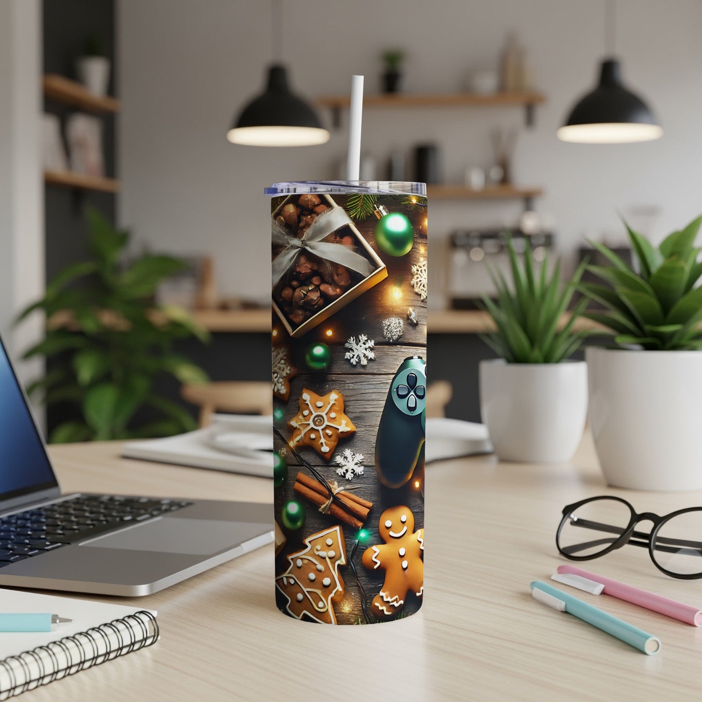 Christmas-themed tumbler with gingerbread cookies, ornaments, and a video game controller.