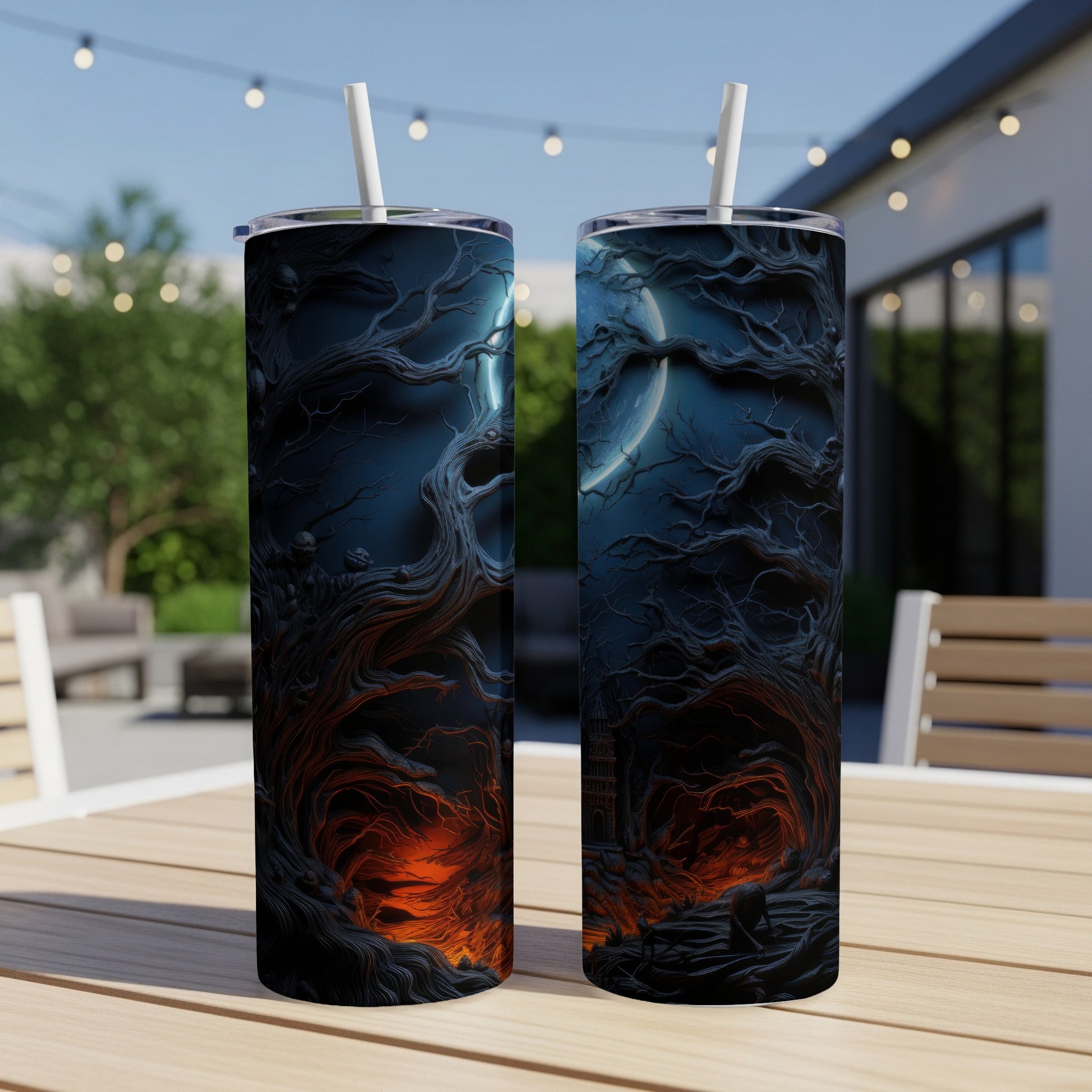 Two tumblers with a spooky forest and moon design, shown outdoors.