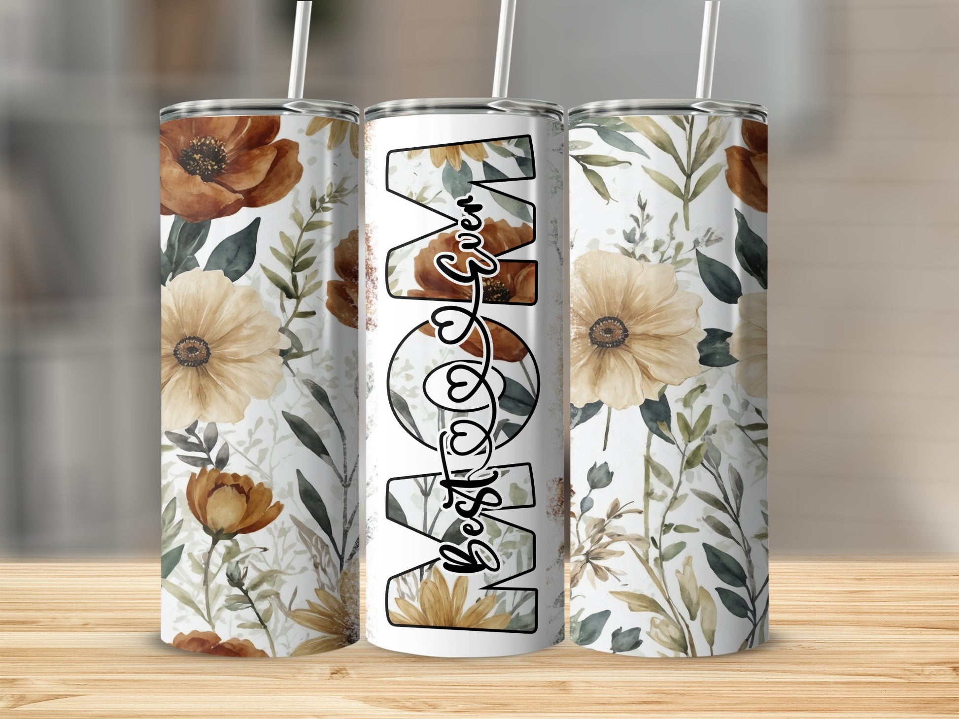 Tall white tumbler with floral design and "Best Mom" text.