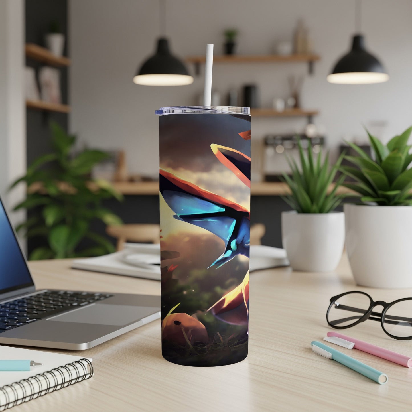 Blue dragon-like creature on a colorful tumbler with a straw.