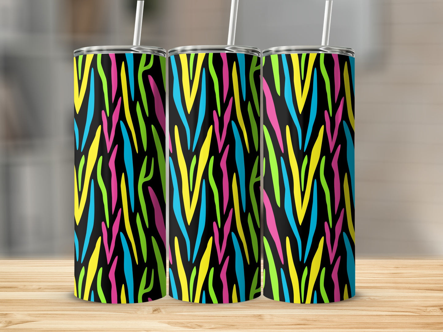 Three tall tumblers with a black base and colorful abstract zebra stripe pattern.