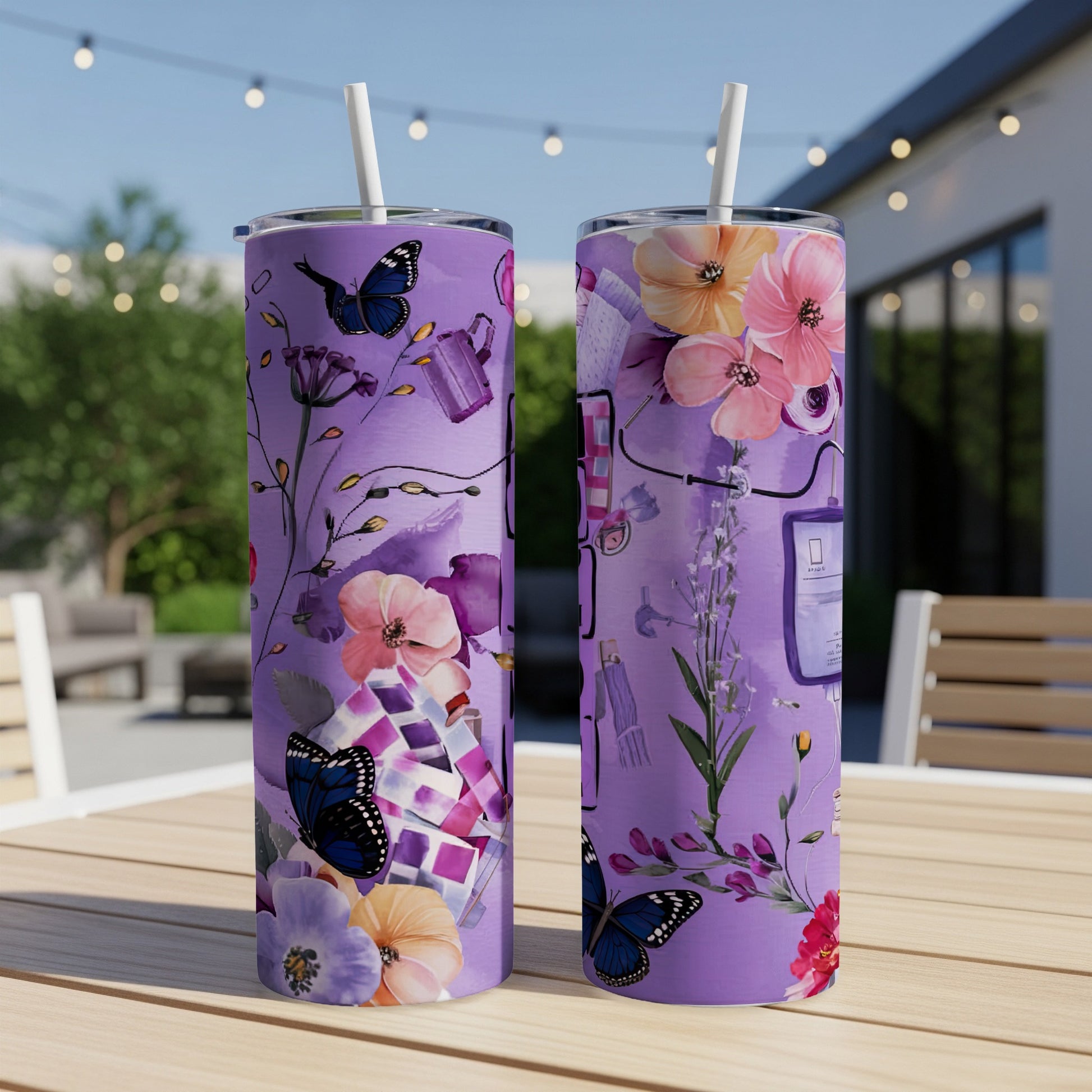 Purple tumblers with floral and butterfly designs on a table.