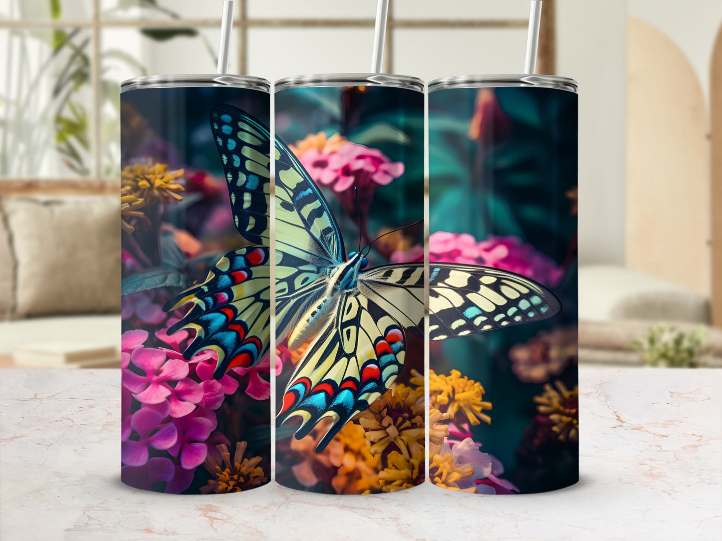 Three tumblers with a large yellow and blue butterfly and colorful flowers.