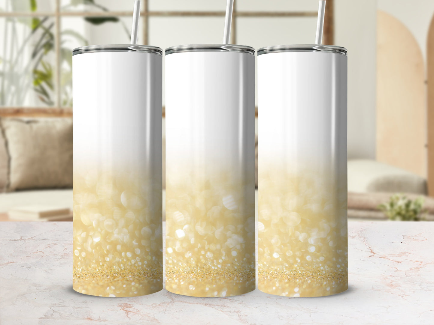 Three white tumblers with a sparkling gold glitter ombre design.
