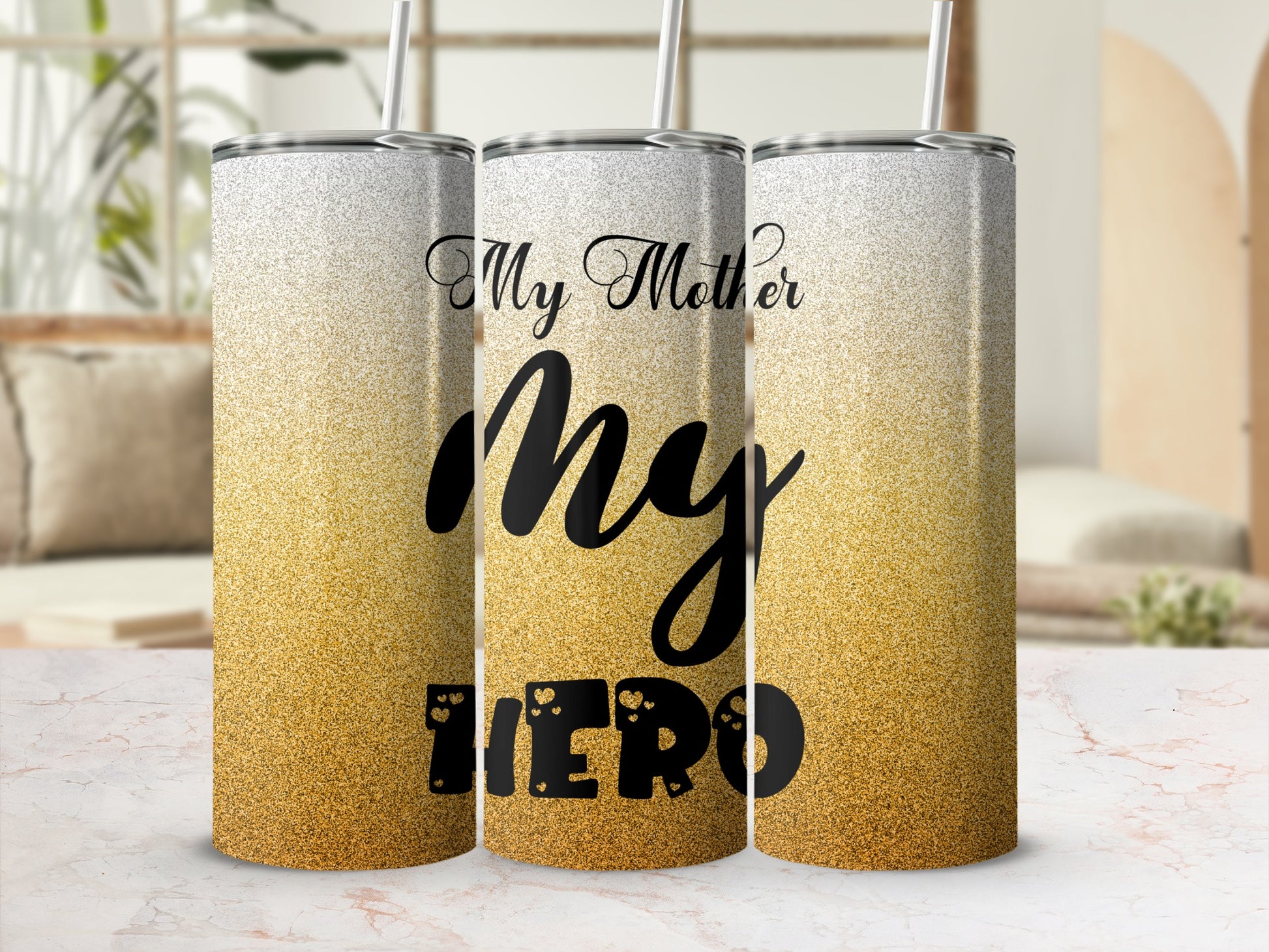 Three glitter-covered tumblers with "My Mother My Hero" text.