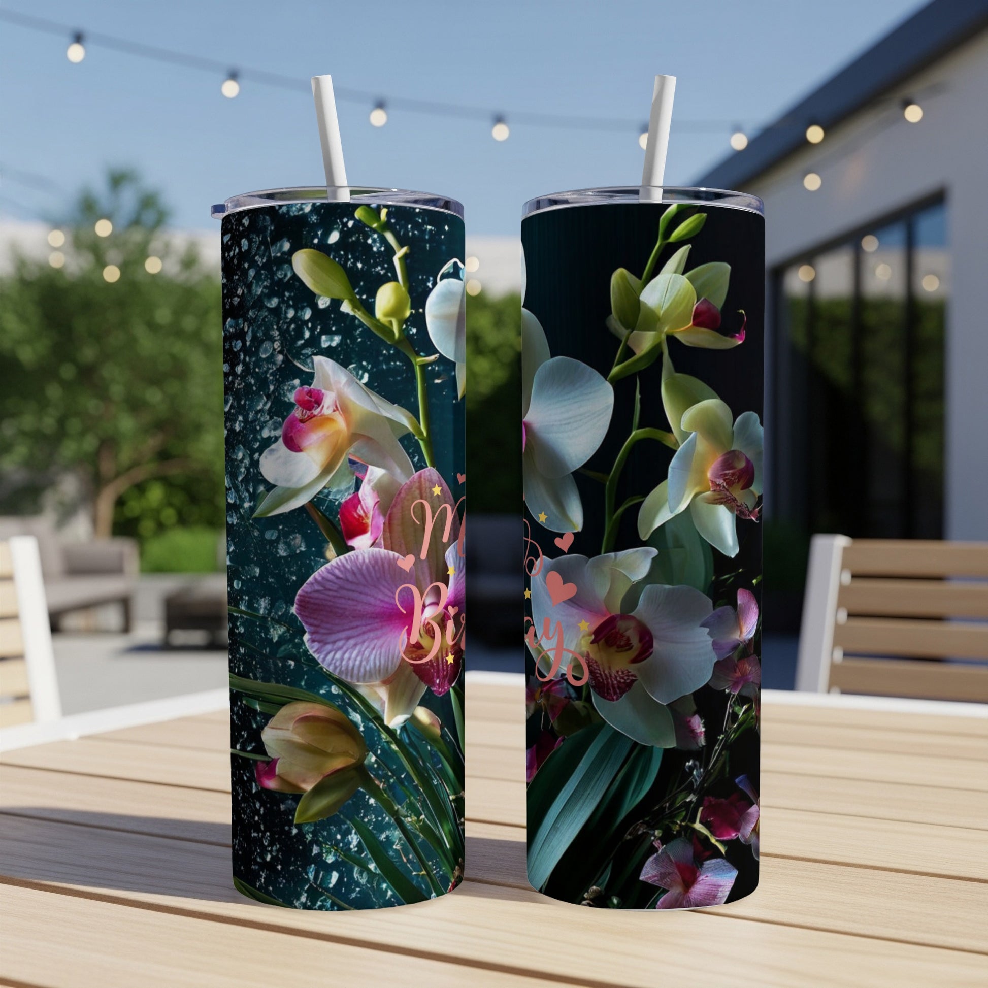Two tumblers with vibrant orchid designs and blurred outdoor background.