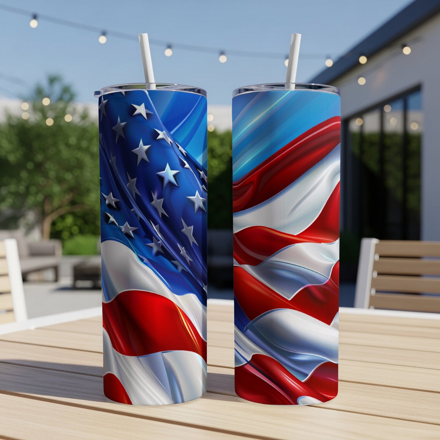 Two tumblers with American flag designs on a wooden table outdoors.