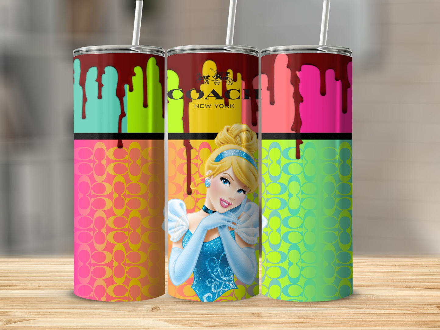 Cinderella and Coach New York logo on drippy paint tumblers with signature pattern.