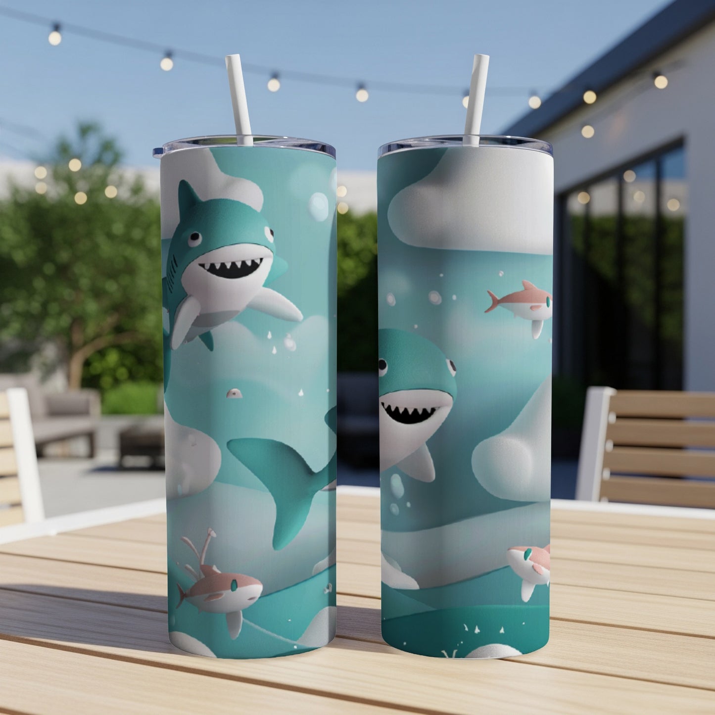 Two tumblers featuring cartoon sharks and fish with a cloudy sky background.