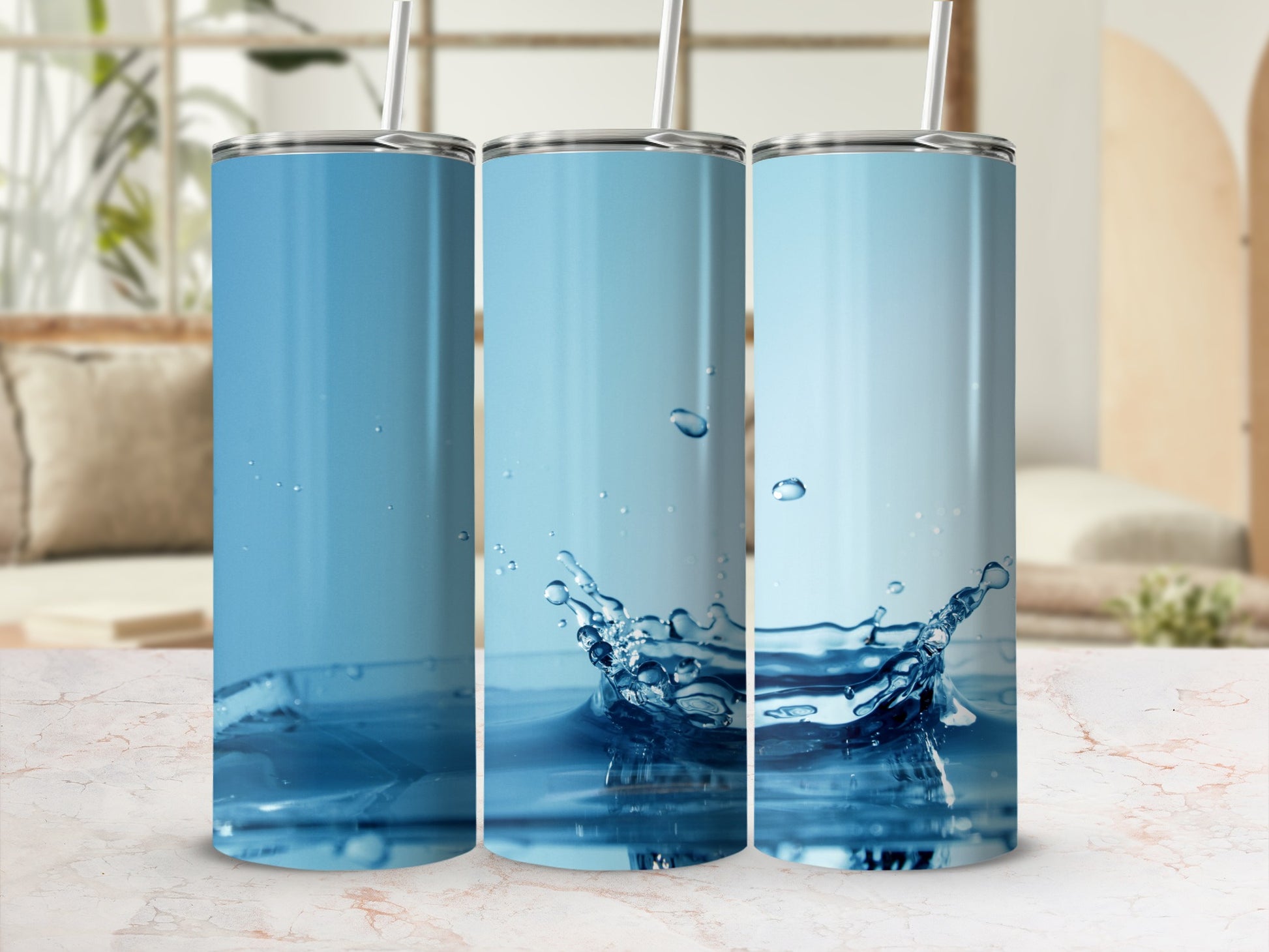 Three tumblers featuring a blue water splash design.
