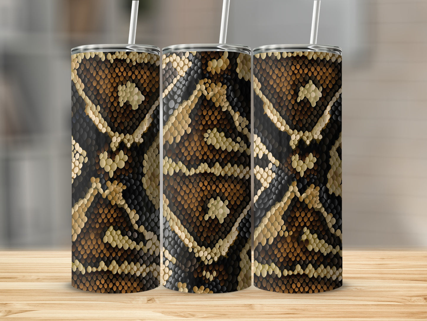 Three tumblers with a brown and black snake skin pattern and straws.
