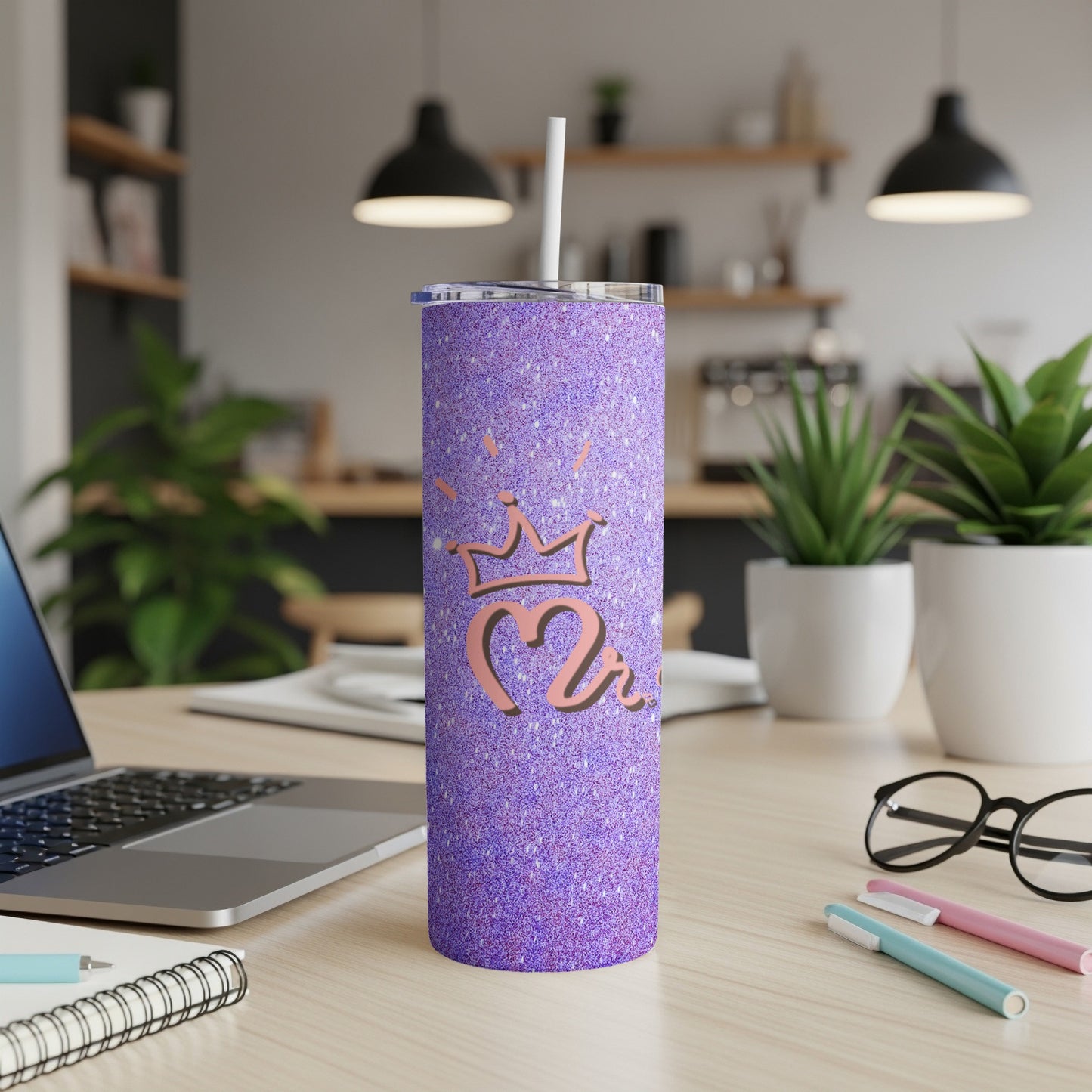 Purple glitter tumbler with a crown and number 2 design.