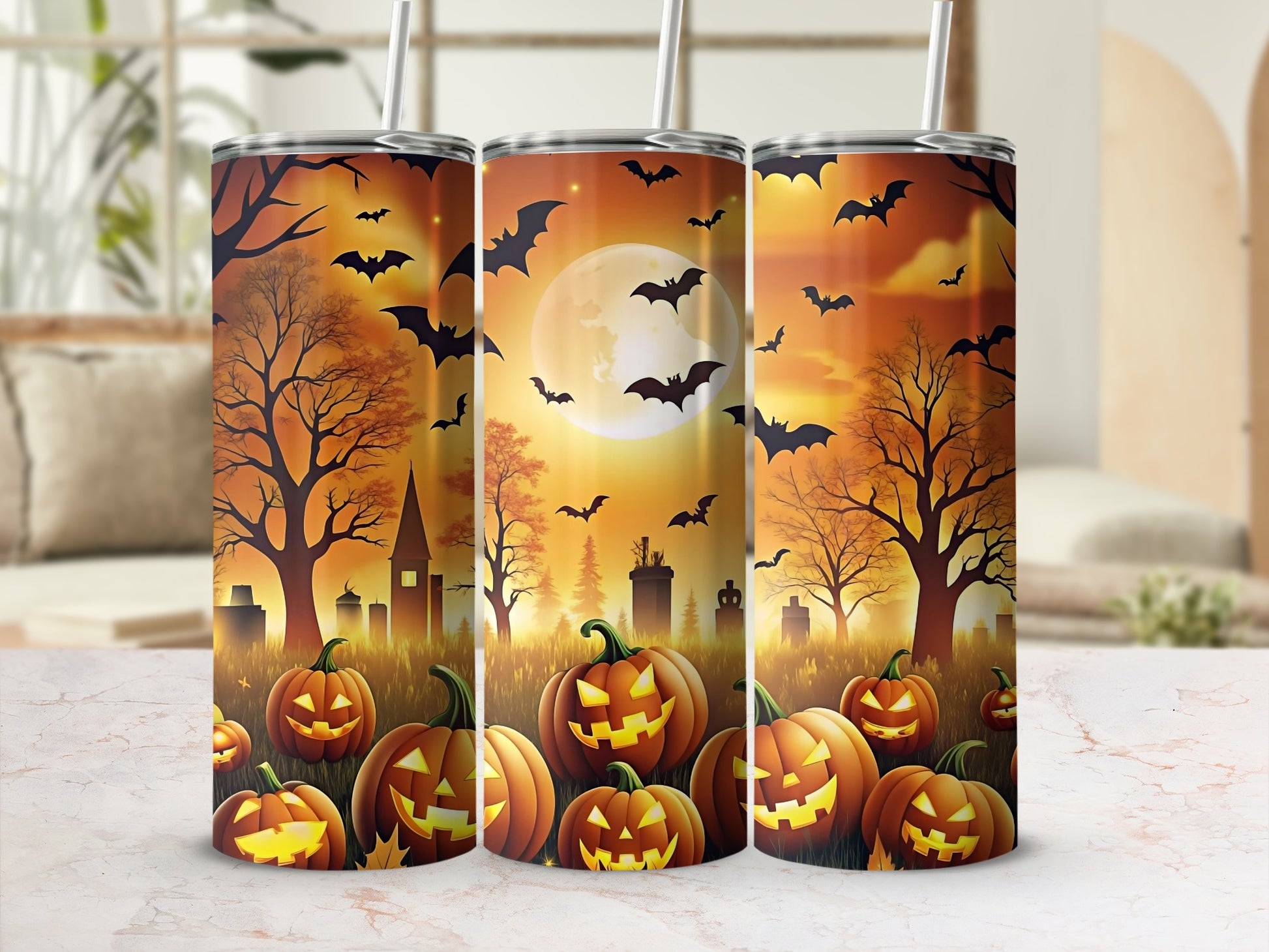 Three Halloween tumblers with bats, pumpkins, and a spooky graveyard scene.