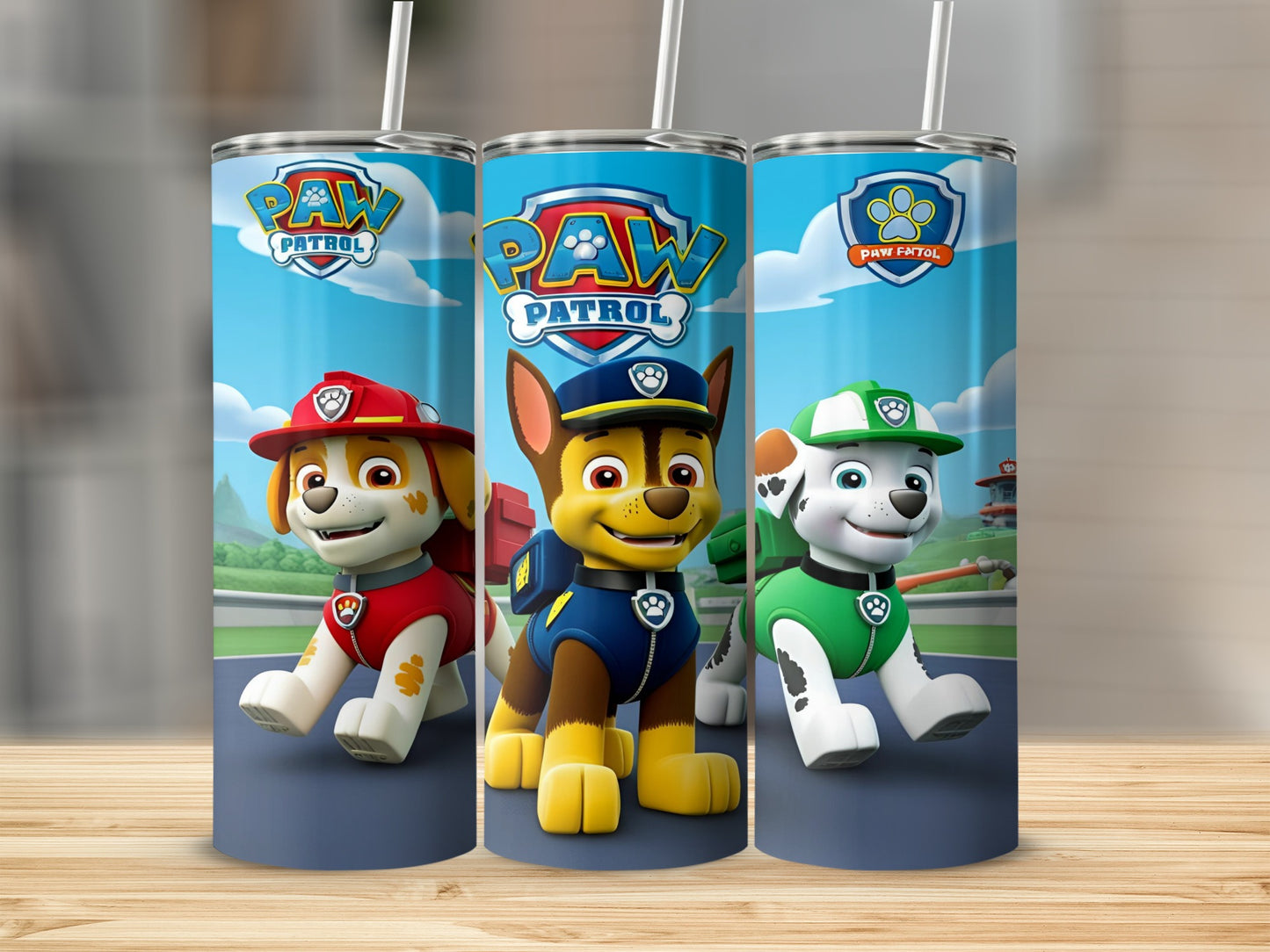 Paw Patrol pups Ryder, Chase, and Marshall on a blue background.
